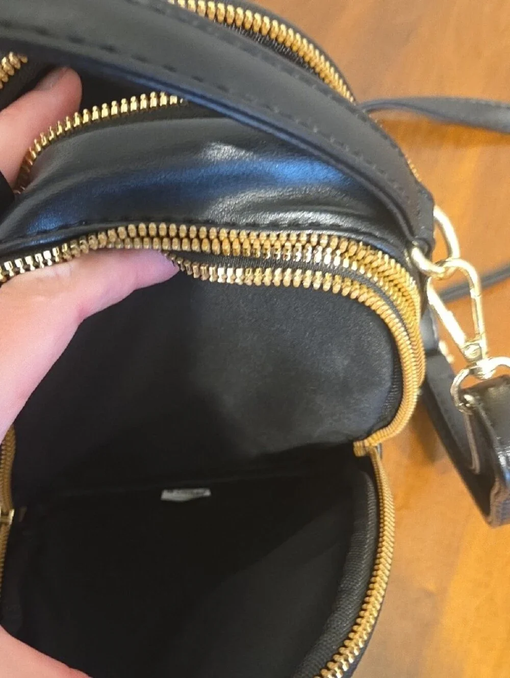 Black Crossbody Bag with Gold Bee Emblem